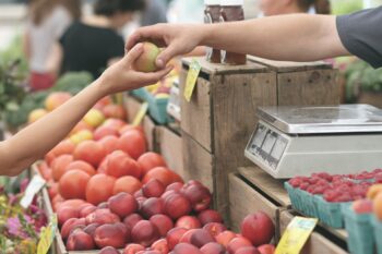 A customer buying fruit.