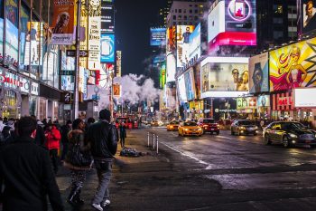 A busy city street at night.