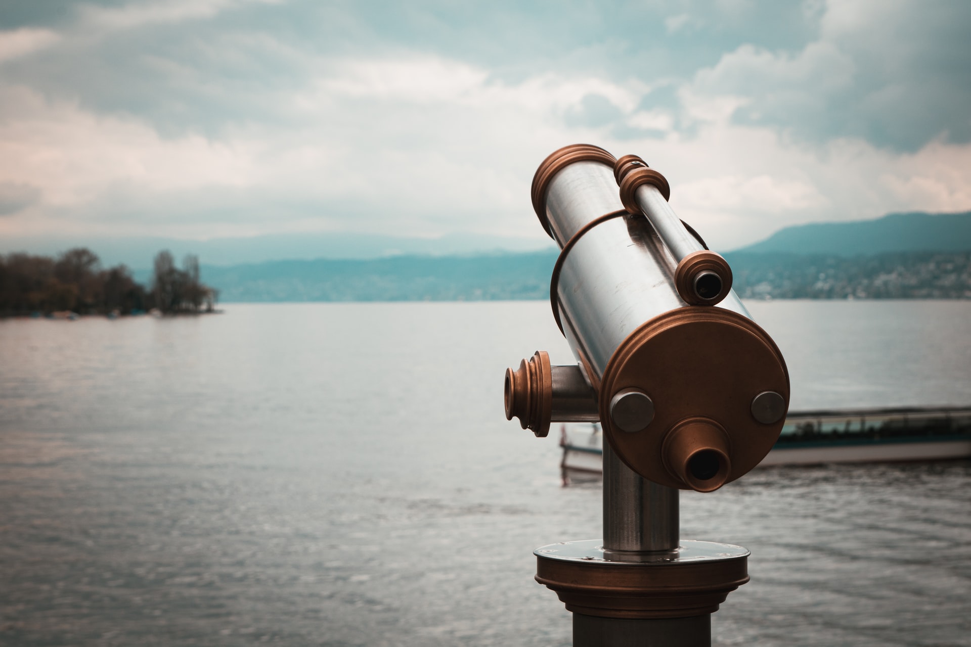 A telescope by a lake.