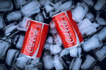 Coca Cola cans in ice.